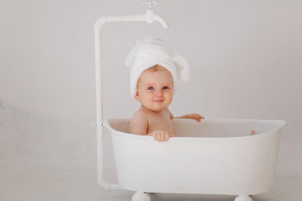 sweet baby girl in bathroom